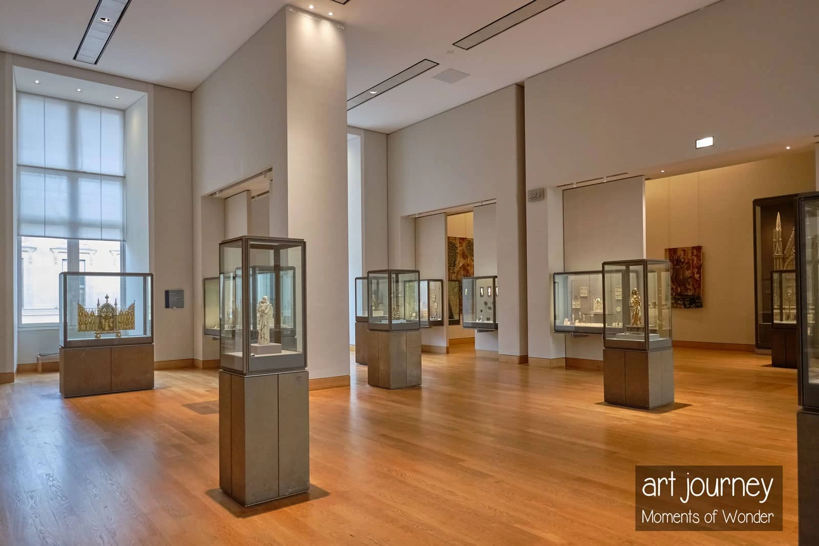 Medieval works of art room empty of the Louvre museum during a private guided visit